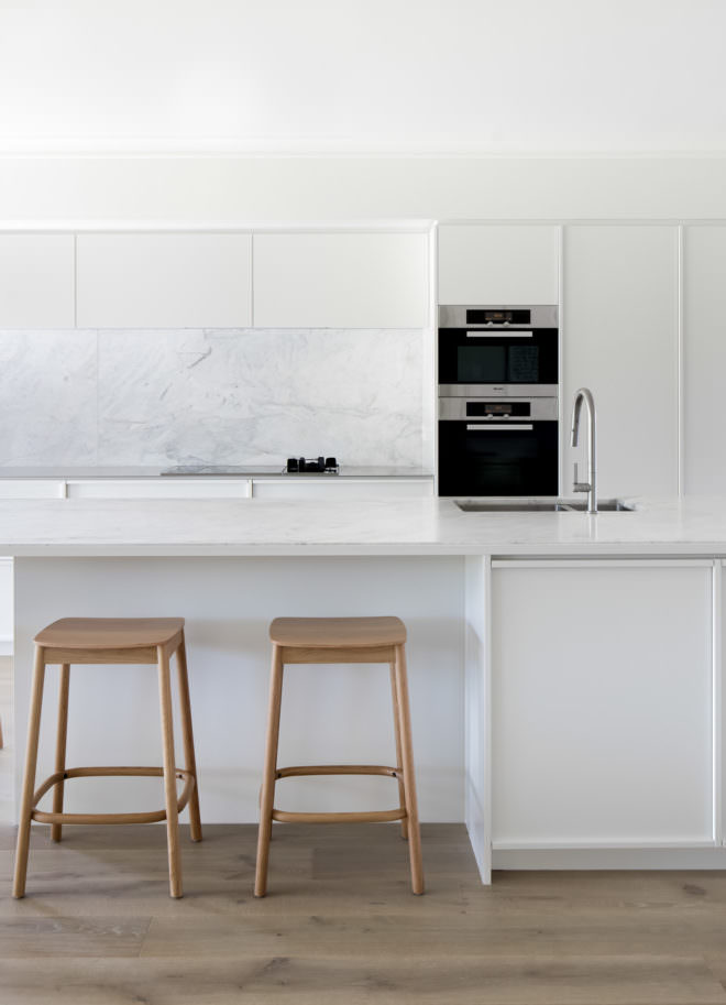 One point prospective white kitchen design interior photograph